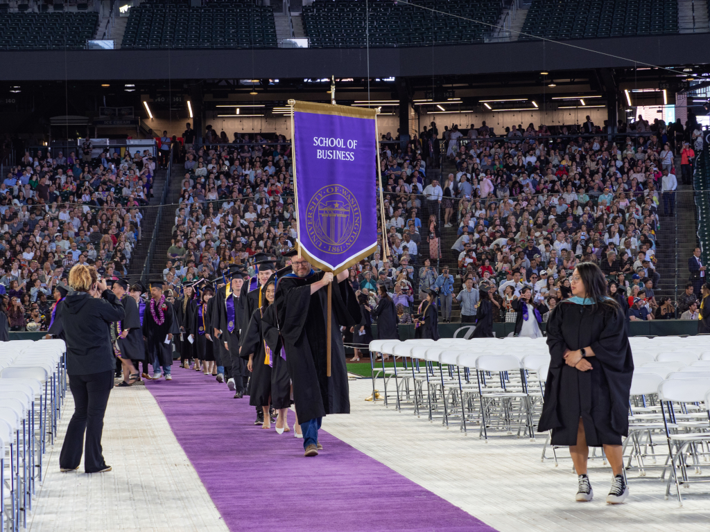 Class of 2024 graduates marching in the stadium during commencement